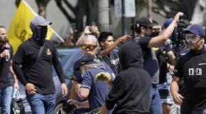 Man Stabbed, Reporter Attacked at Vaccine Protest