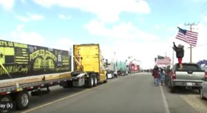 U.S. truckers hit road in opposition to COVID mandates